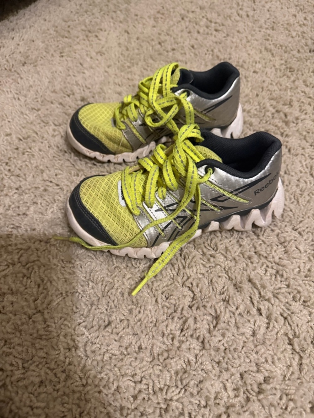 Reebok tennis shoes like green and silver size toddler 11 laces